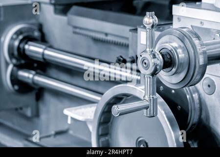 Lathe control knobs close up blue tone. Metal machine tools industry. The metalworking process by turning machine. industry metal processing concept b Stock Photo