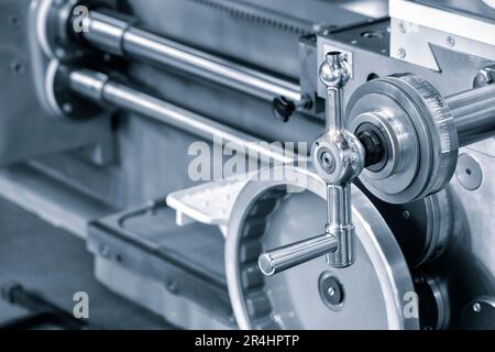 Lathe control knobs close up blue tone. Metal machine tools industry. The metalworking process by turning machine. industry metal processing concept b Stock Photo