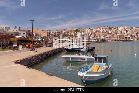 Eastern Crete, Greece, Europe. 2023,  Waterfront of Siteia harbour in Eastern Crete with its small boats, hotels and restaurants on the seafront Stock Photo