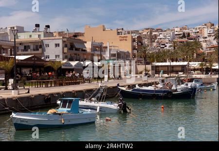 Eastern Crete, Greece, Europe. 2023,  Waterfront of Siteia harbour in Eastern Crete with its small boats, hotels and restaurants on the seafront Stock Photo