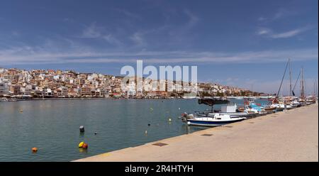 Eastern Crete, Greece, Europe. 2023,  Waterfront of Siteia harbour in Eastern Crete with its small boats, hotels and restaurants on the seafront Stock Photo