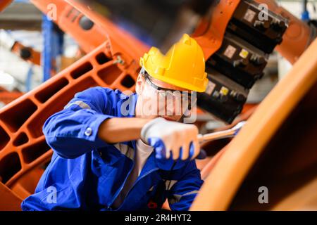 Maintenance engineers team working together at industrial factory Stock Photo