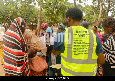 People are seen receiving free medical care at a makeshift shelter at the Durumi IDP Camp in Abuja. The Durumi IDP Camp houses over 2,000 internally displaced persons. People displaced are sheltered in camps due to insurgency in the northeastern provinces of Nigeria which continues to increase every day. Nigeria. Stock Photo