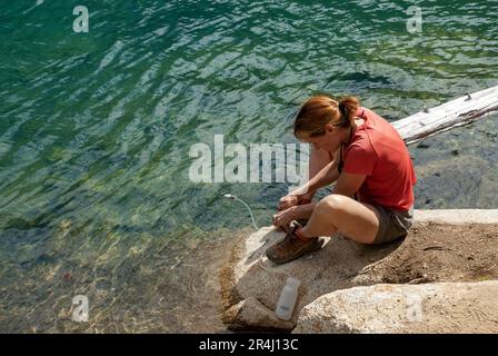 Single woman below Dragon Tail Peak, Cascades Mountains, Washington Stock Photo