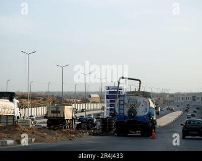 Cairo, Egypt, May 18 2023: preparations to place large water pipe parts in place, sanitation pipes, improvement of infrastructure and real estate deve Stock Photo