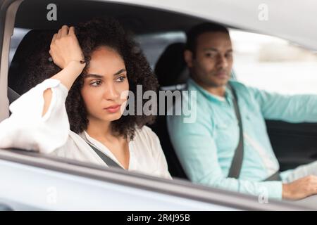 Displeased Middle Eastern Wife Expressing Unhappiness Towards Husband In Car Stock Photo