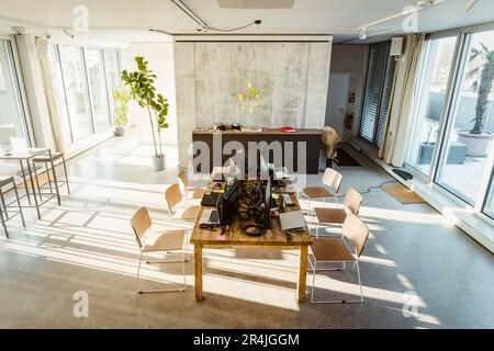 High angle view of computers and laptops on desk in creative office Stock Photo