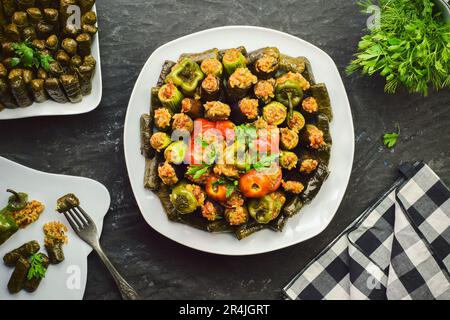 Arabic Cuisine; Middle Eastern traditional dish 'Mahshy' or 'Dolma'. Stuffed Zucchini, eggplant, tomato, peppers and vine leaves. Stock Photo