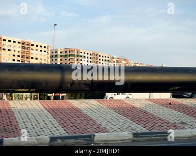 Cairo, Egypt, May 18 2023: preparations to place large water pipe parts in place, sanitation pipes, improvement of infrastructure and real estate deve Stock Photo