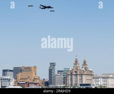 Liverpool Pier Head, Liverpool, Merseyside, England. 27th May 2023. Battle of Britain memorial fly performs a flypast with the Spitfire, Lancaster and Hurricane in formation over Liverpool, during the Battle of the Atlantic 80th anniversary at Pier Head. (Credit Image: ©Cody Froggatt/Alamy Live News) Stock Photo