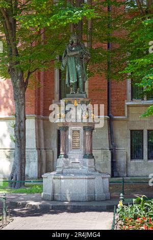 Krakow, Poland - June 07 2019: The Nicolaus Copernicus Monument (Polish: Pomnik Mikołaja Kopernika) is a notable landmark designed by sculptor Cyprian Stock Photo