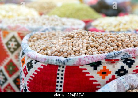 Dried chickpeas in a suck with Middle-East ornament in a local market Stock Photo