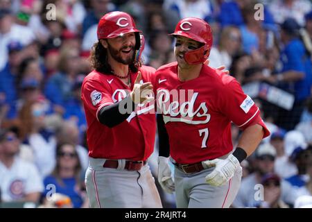 Cincinnati Reds' Jonathan India, right, celebrates with third base coach  J.R. House (56) after hitting a two-run home run during a baseball game  against the Milwaukee Brewers in Cincinnati, Friday, June 2