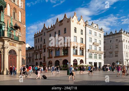 Krakow, Poland - June 06 2019: Hard Rock Cafe next to the St. Mary's Basilica on the Main Market Square in the old town. Stock Photo