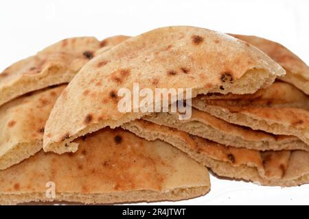 Traditional Egyptian flat bread with wheat bran and flour, regular Aish Baladi or Egypt bread baked in extremely hot ovens, it is the result of a mixt Stock Photo