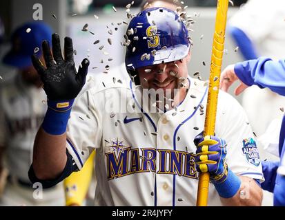 Seattle Mariners' Julio Rodríguez holds a trident in the dugout after  hitting a home run in a baseball game against the Texas Rangers, Thursday,  Sept. 28, 2023, in Seattle. (AP Photo/Lindsey Wasson