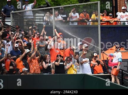 Mr. Splash sprays fans in the Bird Bath Splash Zone during the seventh  inning of a baseball game between the Baltimore Orioles and the Texas  Rangers, Friday, May 26, 2023, in Baltimore.