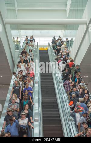People Riding Escalator Stock Photo