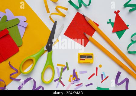 Flat lay composition with stationery, confetti and paper gift boxes on white background Stock Photo