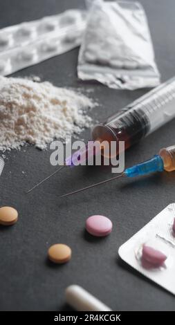 Different hard drugs on black background, closeup Stock Photo