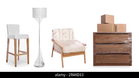 Furniture and lamp wrapped with stretch film and cardboard boxes on white background Stock Photo