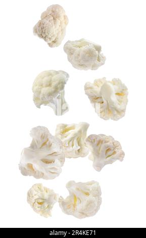 Many fresh cauliflower florets falling on white background Stock Photo