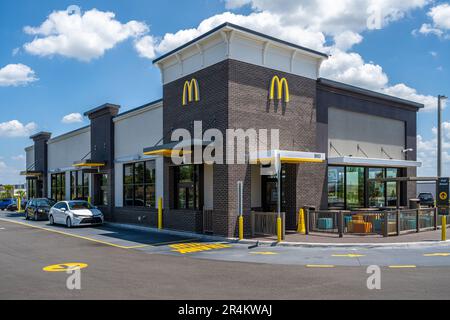 McDonald's fast food restaurant with drive-thru customers in Minneola, Florida. (USA) Stock Photo