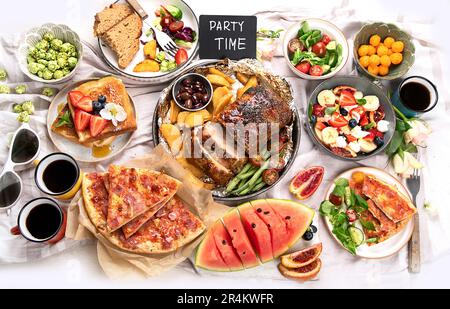 Family dinner or lunch. Many dishes on the table. Top view Stock Photo