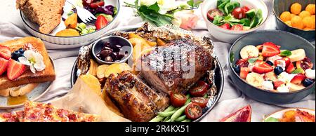 Family dinner or lunch. Many dishes on the table. Stock Photo