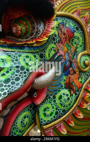 A closeup of a colorful decorated Dragon face. Stock Photo