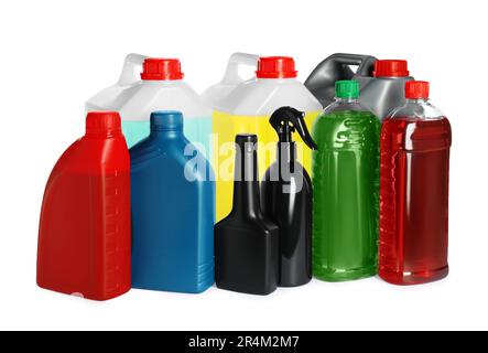 Many bottles and canisters with liquids on white background Stock Photo