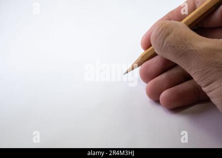 Isolated Hand Holding a Pencil on White Background Stock Photo