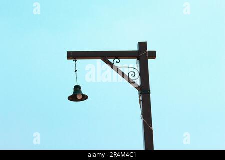 electric bulb bell shape in the street view on the sky Stock Photo