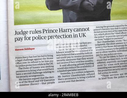 'Judge rules Prince Harry cannot pay for police protection in UK' Guardian newspaper headline royal security article 24 May 2023 London UK England Stock Photo