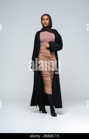 Beautiful arab middle-eastern woman with traditional abaya dress in studio  - Black african muslim adult female wearing fashionable and stylish arabic  Stock Photo - Alamy