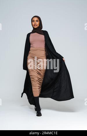 Beautiful arab middle-eastern woman with traditional abaya dress in studio - Black african muslim adult female wearing fashionable and stylish arabic Stock Photo - Alamy Beautiful arab middle-eastern woman with traditional abaya dress in studio - Black african muslim adult female wearing fashionable and stylish arabic Stock Photo - Alamy