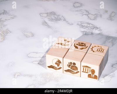 Environmental, Governance and Social criteria symbols on wooden cubes as concept of ESG principles Stock Photo