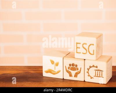 Environmental, Governance and Social symbols on wooden board as concept of ESG principles Stock Photo