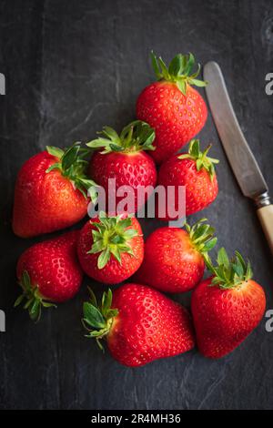 Summer Strawberries on a slate background Stock Photo