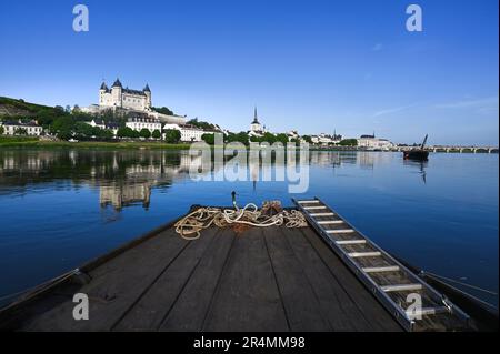 View of the French capital of sparkling wines, Saumur, with its castle high above at the valley of the Loire river, France Stock Photo