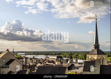 The spire of the St Peter's Church dominates the skyline of Saumur, the capital of sparkling Loire river wines, in France Stock Photo