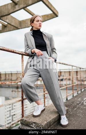 woman on the roof of a multi-apartment house Stock Photo