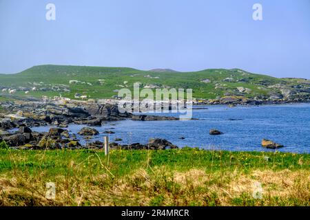 Olberg; Olbergstranden; Raege; Norway; May 20 2023, Cove Or Bay Surrounded By Green Hills Under A Misty Blue Sky Early Morning Light With No People Stock Photo