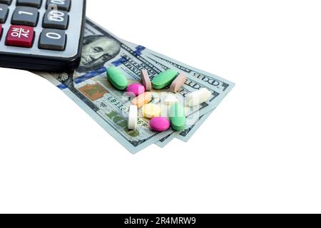 US dollars bills and medicine pills on white isolated background. High cost of medicine concept. Stock Photo