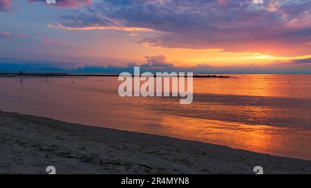 Beautiful sunset over the Baltic Sea. Sea breakwaters. Darlowo, Poland Stock Photo