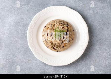 Traditional delicious Turkish food; rice pilaf with pine nuts and currants (Turkish name; ic pilav or pilaf) Stock Photo