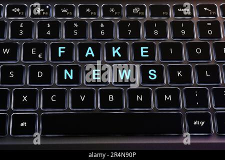 stop fakes - two red buttons on laptop keyboard. finger tries to press