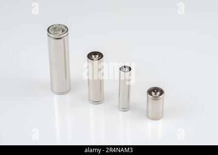 Alkaline batteries lie on white background, The concept of vital energy reserve Stock Photo