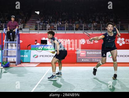 Kuala Lumpur, Malaysia. 28th May, 2023. Feng Yan Zhe (R) and Huang Dong Ping of China play against Dechapol Puavaranukroh and Sapsiree Taerattanachai of Thailand during the Mixed Doubles final match of the Perodua Malaysia Masters 2023 at Axiata Arena. xx won with scores; 21/13/18 : 16/21/21. (Photo by Wong Fok Loy/SOPA Images/Sipa USA) Credit: Sipa USA/Alamy Live News Stock Photo