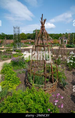 Ornamental woven plant supports in the Kitchen garden at RHS Bridgewater, Worsley Greater Manchester, England. Stock Photo